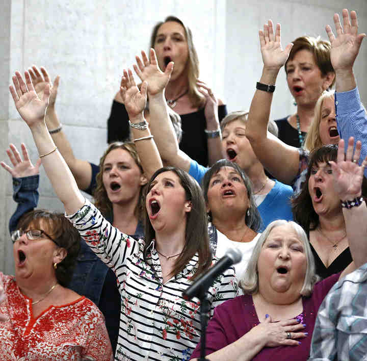 Members of the Genoa Church Choir sing praises to God during the National Day of Prayer event at the Ohio Statehouse.  (Fred Squillante / The Columbus Dispatch)